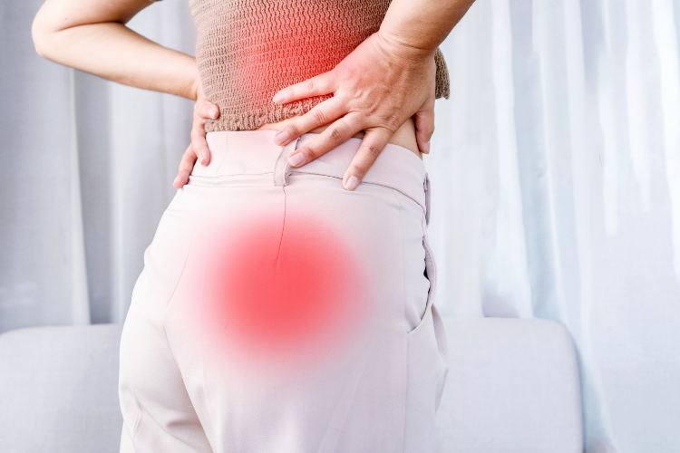 Woman experiencing sciatic nerve pain in lower back and hip