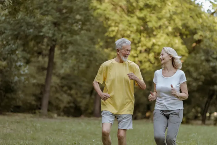 Senior Couple Jogging Outdoors for HRV Therapy Recovery
