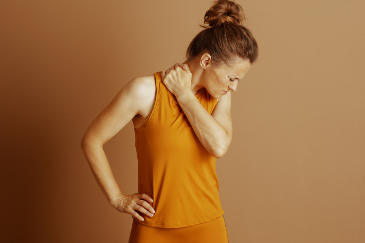 Woman experiencing shoulder pain needing PT treatment relief