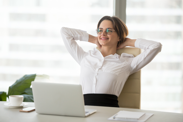 Relaxed Office Worker Practicing Workplace Ergonomics Tips